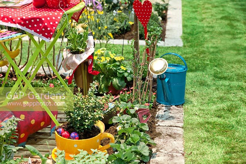 Plant border with watering can
