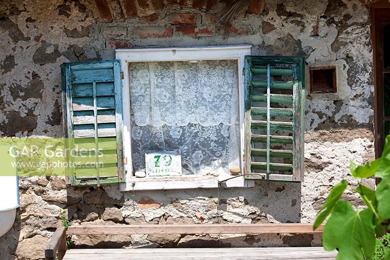 Old window with wooden shutters