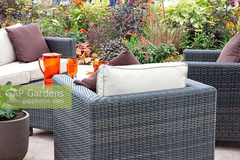 Terrace with wicker garden furniture