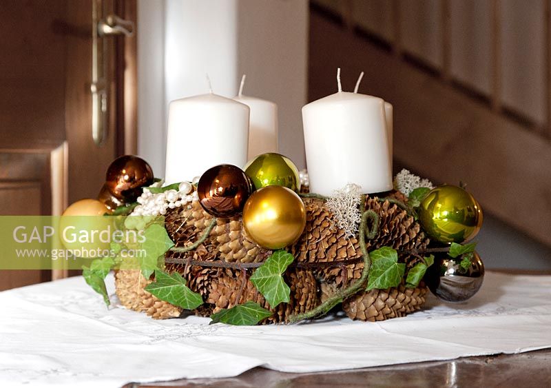 Advent wreath with cones and Christmas decoration