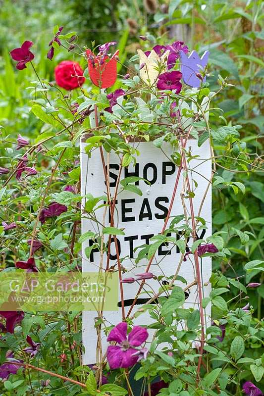 Cerney House Gardens, Gloucestershire, UK. ( Sir Michael and Lady Angus ) Walled kitchen garden, 'shop, teas, pottery' sign