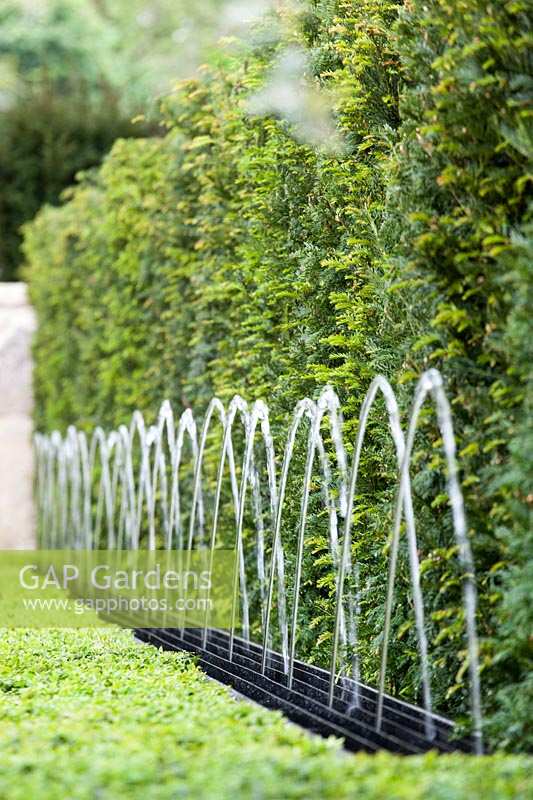 Fountain water feature in Box hedging, The Arthritis Research Garden, des. Thomas Hoblyn.