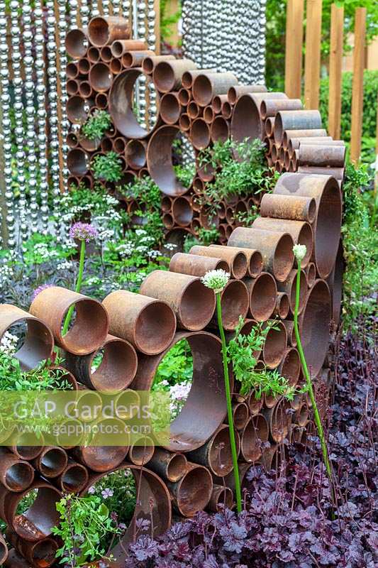 Chelsea Flower Show, 2013. The SeeAbility Garden. Metal pipe fence