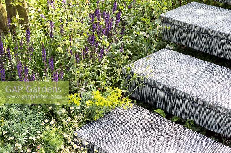 Steps made from hand-cut slate stacked together. The Brewin Dolphin Garden. RHS Chelsea Flower Show, 2015