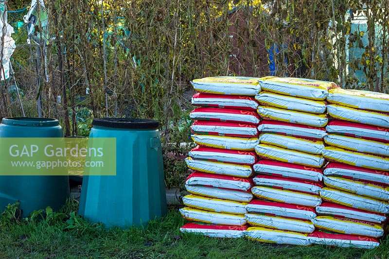 Piles of fertiliser bags on allotment