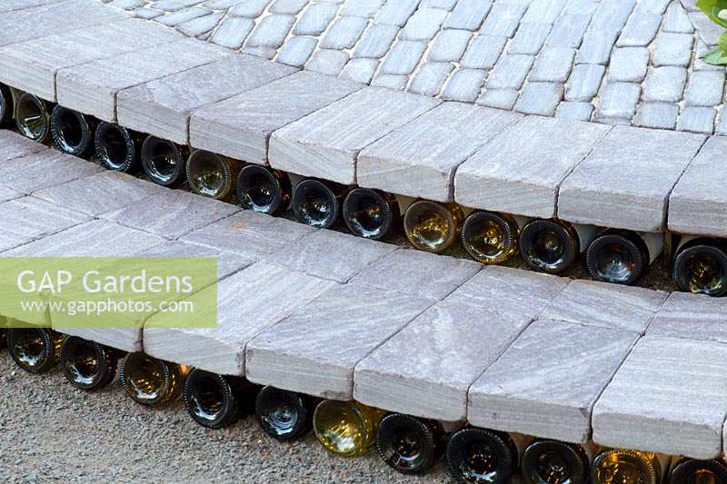 Hampton Court Flower Show 2014, the Bacchus Garden, des. Wardrop Designs. Old wine bottle steps risers
