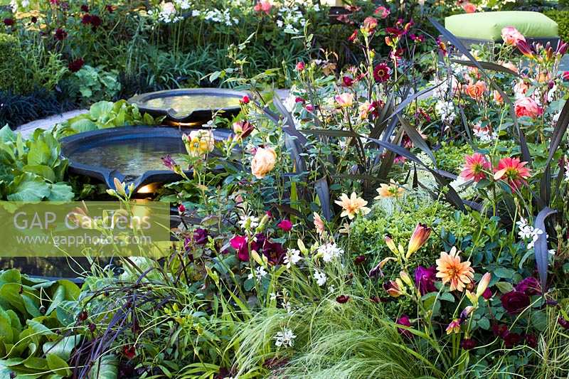 Hampton Court Flower Show 2014, the Bacchus Garden, des. Wardrop Designs. Three tiered Circular pools water feature