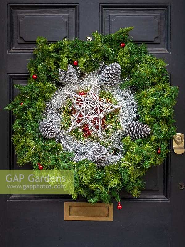 Beautiful Christmas wreath hung on period front door