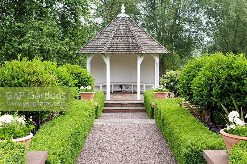 Mitton Manor, Staffordshire.  Summerhouse in formal garden parterre