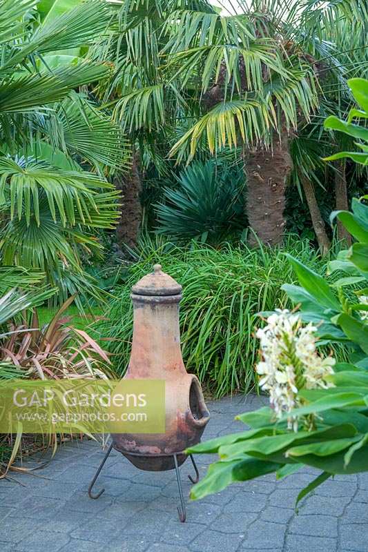 Beechwell Garden ( Tim Wilmot ), Bristol, UK. Exotic town garden with architectural, sub tropical planting. Chiminea