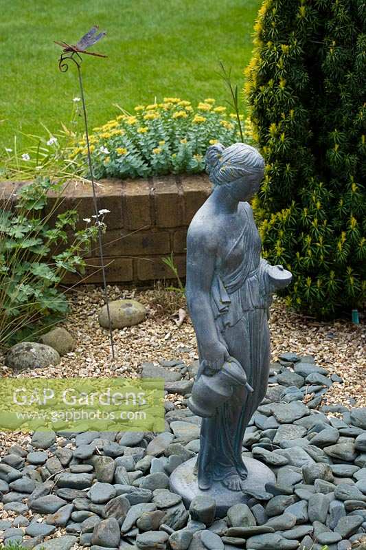 Sheila White's garden, Queens Gate, Bristol, UK. classical statue in gravel border