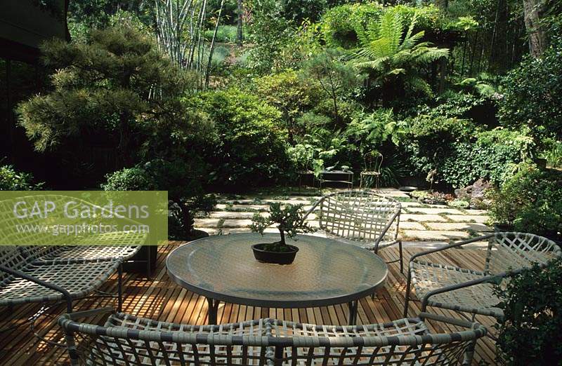 shady raised wooden decking seating area Pasadena California Design Lois Brown table and chairs