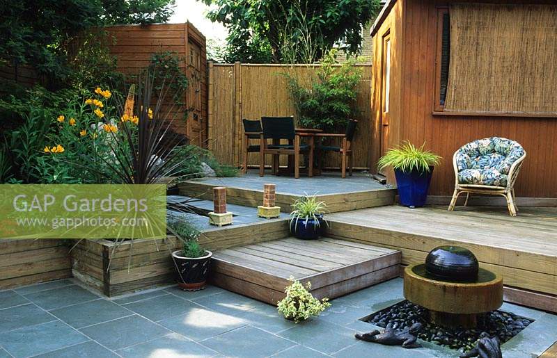private garden London Design Kristina Fitzsimmons small town patio garden with split levels water feature seating