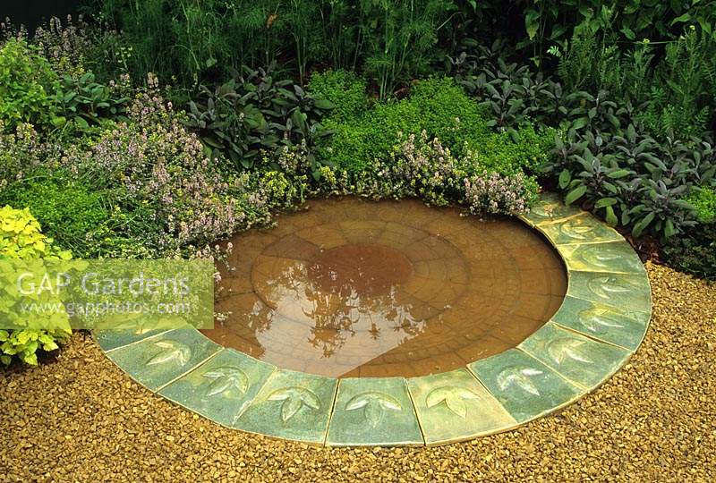 Hampton Ciiurt FS 1992 small formal circular pool and herbs in patio garden
