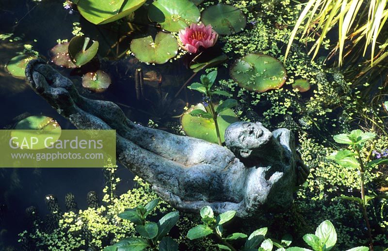 figurative sculpture by Janis Ridley in pond