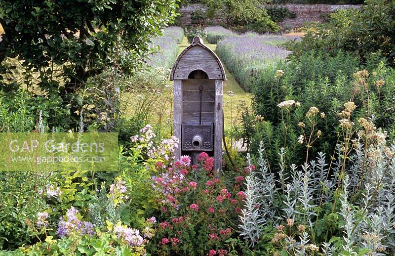 antique water pump feature centranthus ruber english lavender beds Silver and burgundy colour combination. Artemisia
