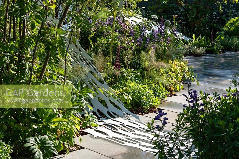 Borders of mixed planting in the Manchester Garden at RHS Chelsea Flower Show 2019. Designed by Exterior Architecture.