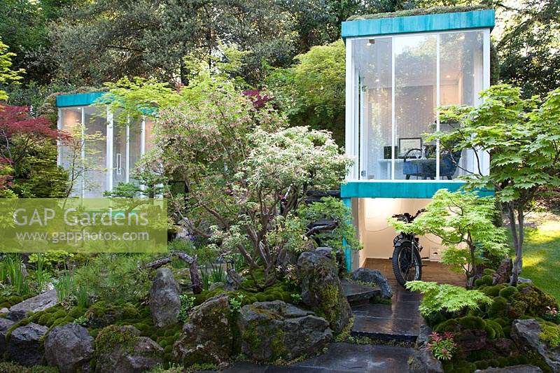 The Green Switch Garden, view  of the living spaces which overlook the garden and the moss covered rocks surrounding it - Designer: Kazuyuki Ishihara. Sponsor: G-Lion