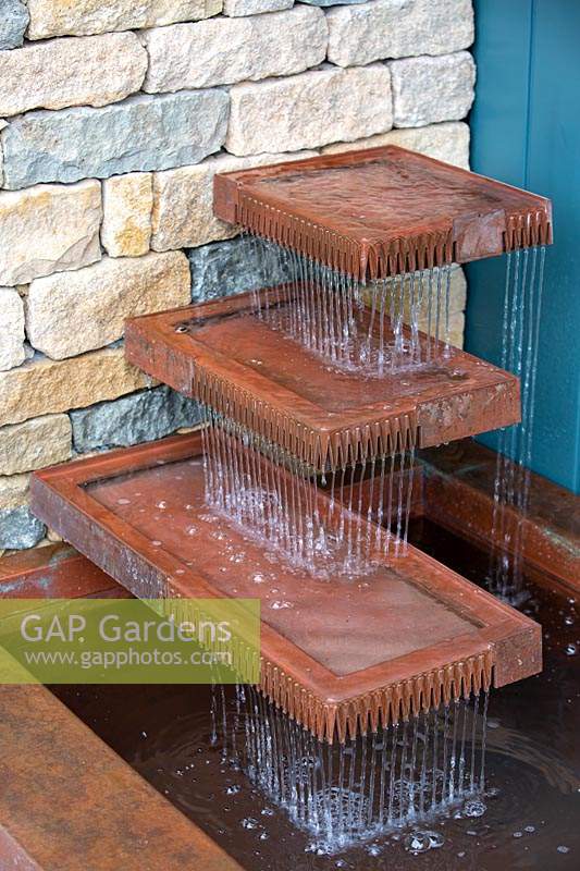 The Warners Distillery Garden, layered copper water feature designed by Andy Ewinź  - Design: Helen Elks-Smith - Construction: Bowles and Wyer - Sponsor: Warners Gin.