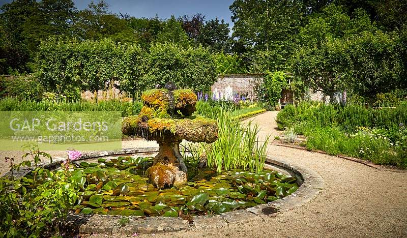 Fountain and pond in The Walled Garden, Highgrove, June. 2019.