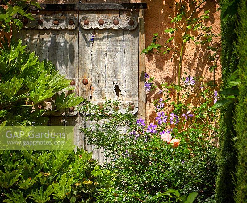 Decorative ornate doors in The Carpet Garden, Highgrove, June, 2019.