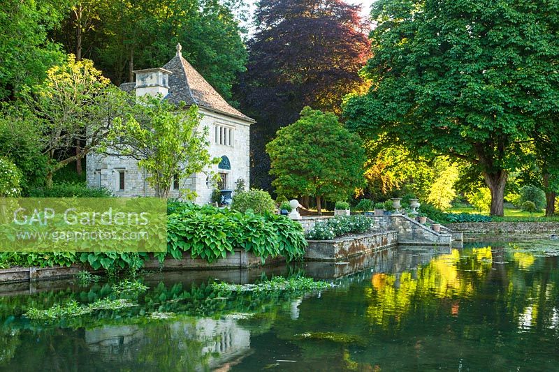 View across the river coln to gazebo,summer house in french style - Ablington manor, gloucestershire: 