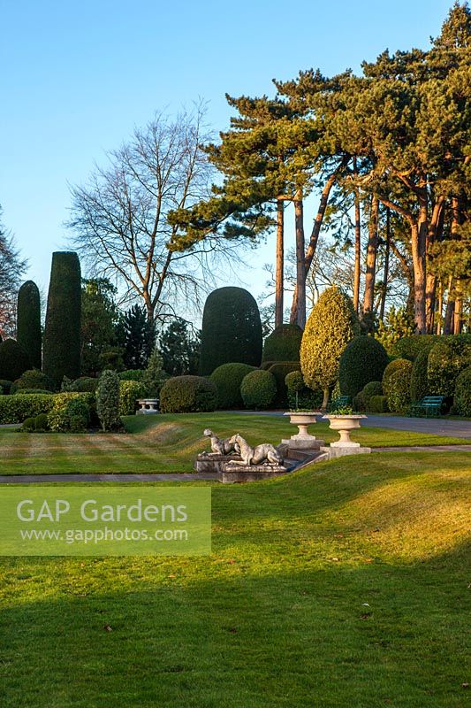A view of the lawns and formal topiary gardens at Brodsworth Hall, Yorkshire. 

