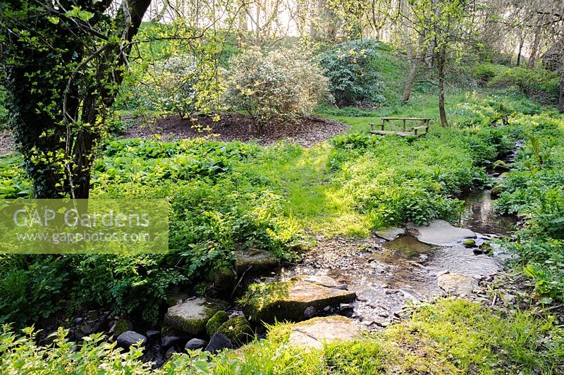 Stream running through the valley garden. Brilley Court Farm, Whitney-on-Wye, Herefordshire