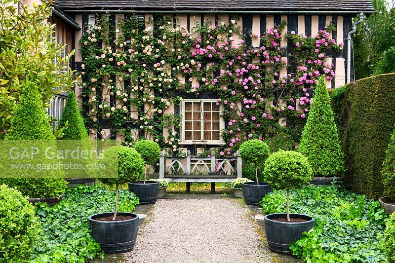 A view of a formal garden at Wollerton Old Hall, Shropshire, UK. 
