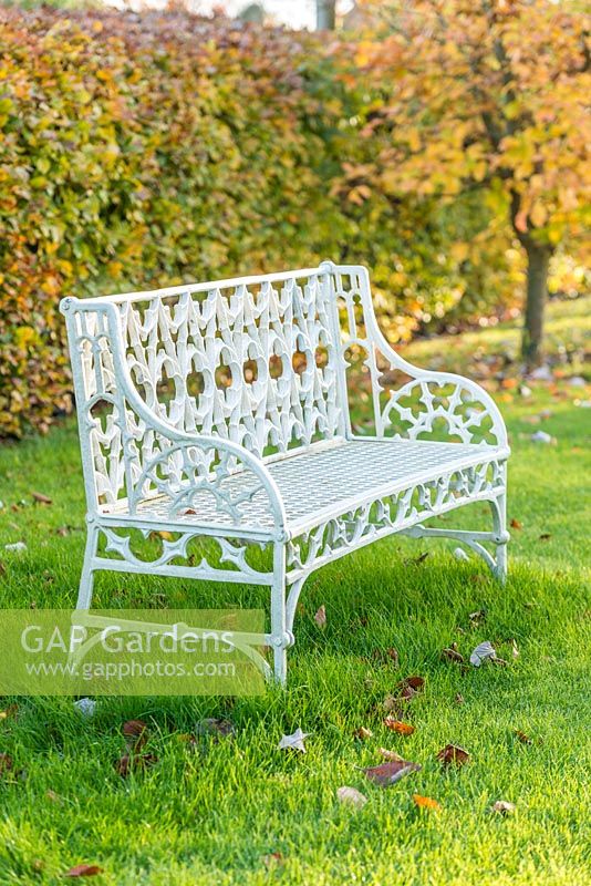 White painted Coalbrookdale gothic garden seat.