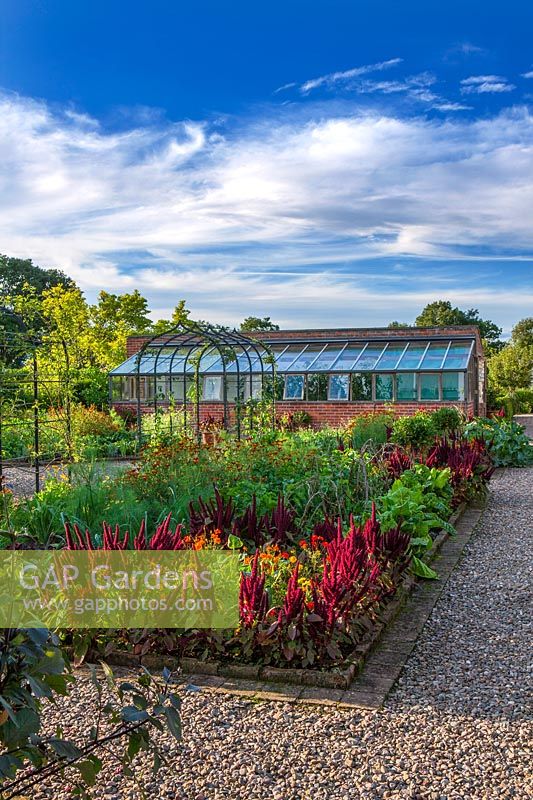 Kitchen garden with greenhouse and archways - Morton Hall Gardens, Worcestershire