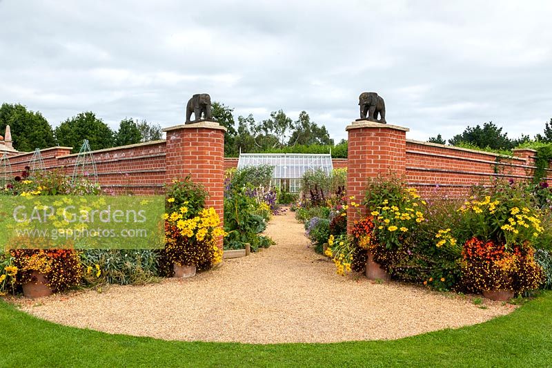 View of grand entrance with elephant statues, into the Diamond Jubilee Walled Garden.
