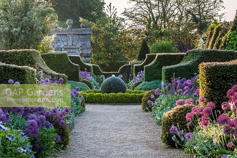 View of the double flowering borders and central topiary feature at Arundel Castle, Sussex.