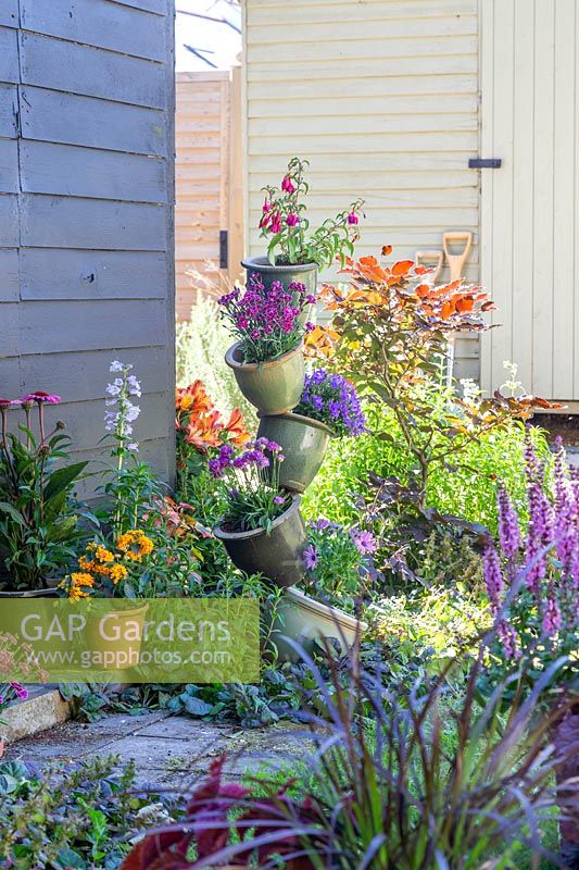 Ceramic pot tower with mixed colourful planting