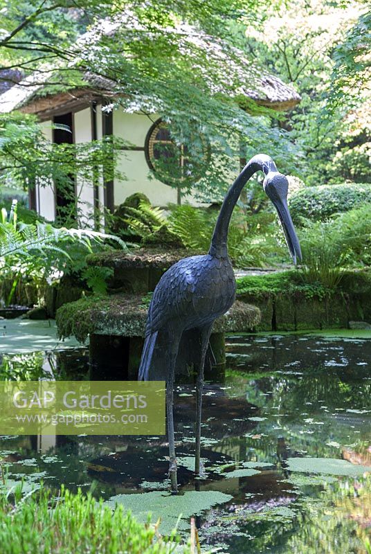 Decorative crane in pool woth Japanese Tea House