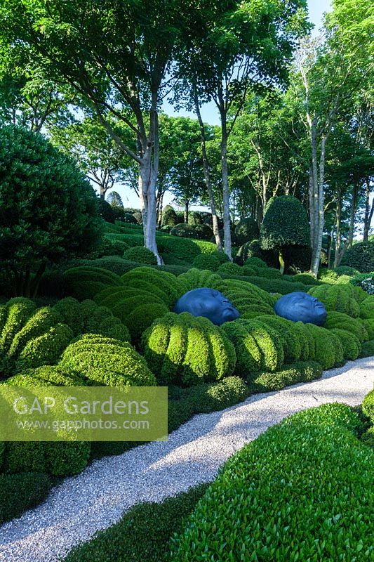 Sculptures by Samuel Salcedo and hedges of Buxus sempervirens. Les Jardins D'etretat, Normandy, France.