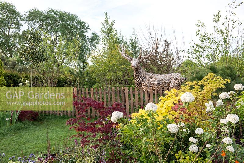 Driftwood Stag sculpture by James Doran-Webb, in 'From over the Fence', RHS Malvern Spring Festival, 2018. 