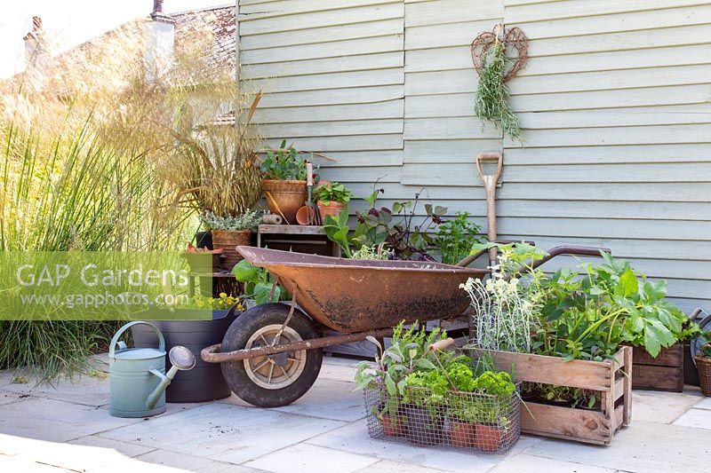 Materials and tools required to construct a wheelbarrow herb planter