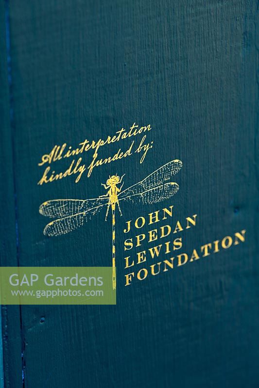 Close up of John Spedan Lewis Foundation logo, The Chelsea Physic Garden, London, UK. 