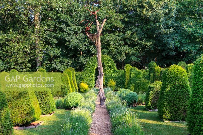 Topiary garden of Taxus baccata - yew with osprey sculpture.
