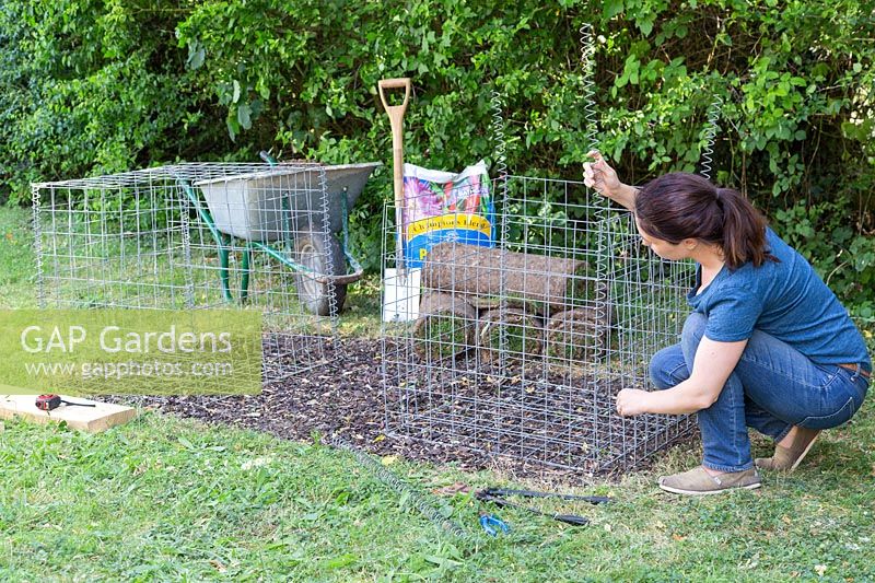 Woman assembling gabion basket using a helical coil spring