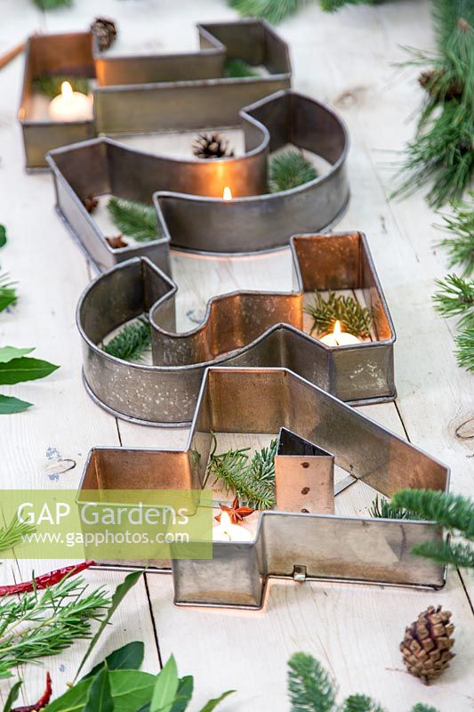2D Advent table decoration with large metal number cake tins