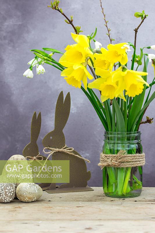 Arrangement with Daffodils, spring snowflake and Easter decorations. 