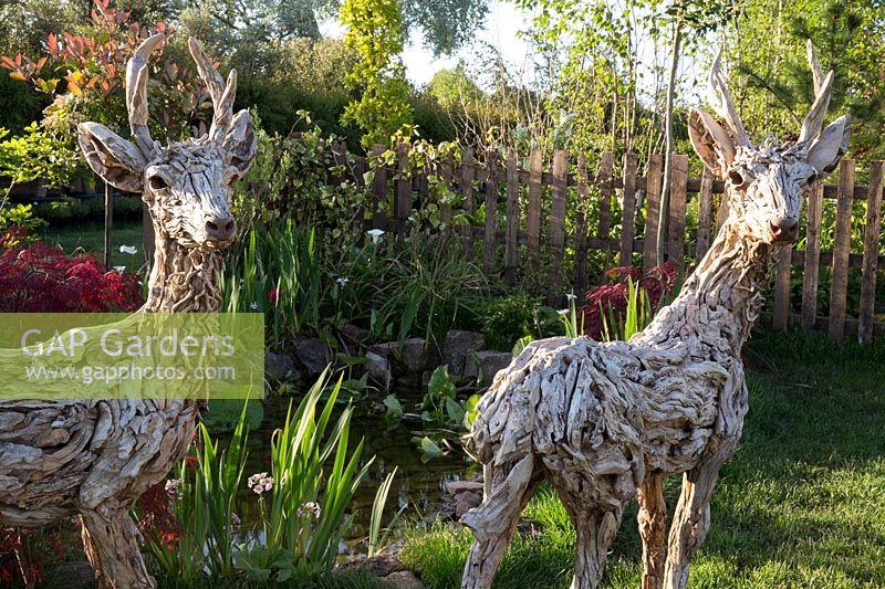 Driftwood deer sculptures by James Doran-Webb,  'From Over the Fence' garden, RHS Malvern Spring Festival 2018.