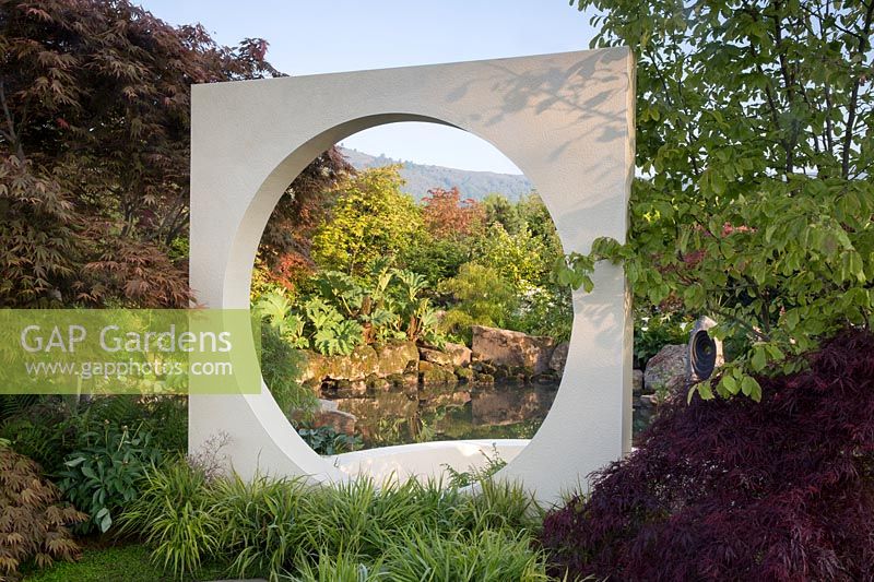 Moongate with view of pond water feature - At One With A Meditation Garden - Howle Hill Nursery, Designer Peter Dowle, RHS Malvern Spring Festival 2017. 