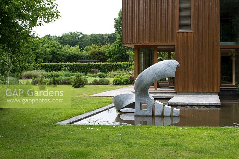 Marble sculpture: Bird by Jessica Walters with oak clad extension by James Gorst, Suffolk