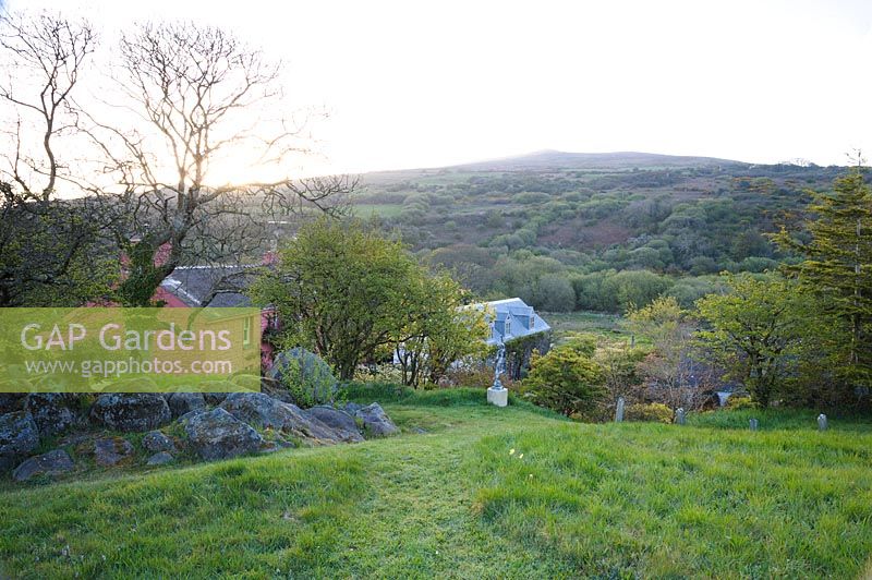 The Magic Garden with views across the house and garden to Garn Fawr and surrounding landscape.