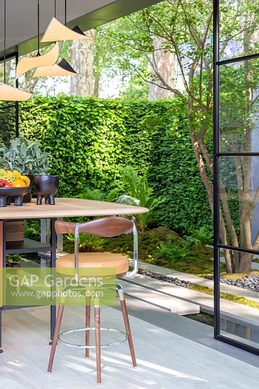 Interior of kitchen with view to garden. The LG Eco-City Garden, Sponsor LG Electronics, RHS Chelsea Flower Show, 2018.