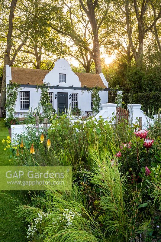 White cottage garden - The Trailfinders South African Wine Estate, RHS Chelsea Flower Show, 2018. Sponsor: Trailfinders Ltd