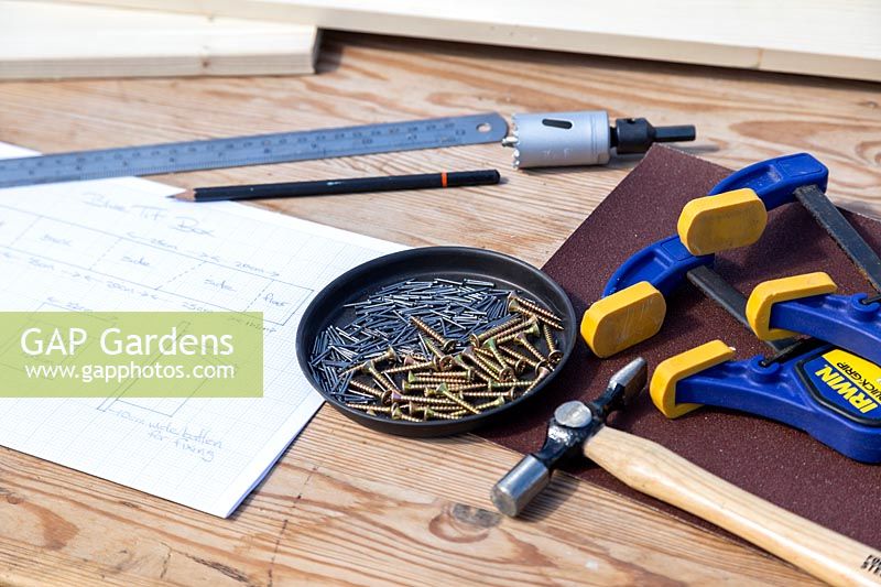 Materials and tools for making a bird box. 